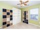 Well-organized bedroom with built-in shelving and window seat at 2019 Tennessee Rd, Durham, NC 27704