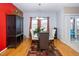 Dining area with a glass table and red accent wall at 2019 Tennessee Rd, Durham, NC 27704