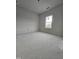 Spacious bedroom with large window and neutral walls at 216 Vili Dr, Broadway, NC 27505