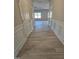 Hallway with wood flooring and white wainscoting at 216 Vili Dr, Broadway, NC 27505