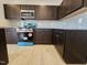 Kitchen with wooden cabinets, stainless steel appliances and gray backsplash at 216 Vili Dr, Broadway, NC 27505