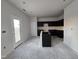 Modern kitchen with dark cabinets and an island at 216 Vili Dr, Broadway, NC 27505