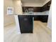 Kitchen island with dark cabinets and granite countertops plus stainless appliances at 216 Vili Dr, Broadway, NC 27505