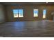 Bright living room featuring hardwood floors and natural light from two windows at 216 Vili Dr, Broadway, NC 27505