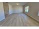 Bright and airy living room with wood-look floors and natural light at 216 Vili Dr, Broadway, NC 27505