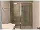 Bathroom featuring a glass-enclosed shower with tile surround at 310 N Maple Walk # 236, Garner, NC 27529