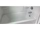 Clean white bathtub with silver fixtures at 310 N Maple Walk # 236, Garner, NC 27529