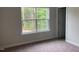 Cozy bedroom with a large window, perfect for relaxation and peaceful rest at 310 N Maple Walk # 236, Garner, NC 27529