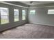 Bedroom with large windows offering neighborhood views and plenty of sunshine at 310 N Maple Walk # 236, Garner, NC 27529
