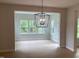 Dining area with natural light and stylish lighting at 310 N Maple Walk # 236, Garner, NC 27529