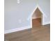 Unique built-in dog nook that showcases hardwood floors and white trim at 310 N Maple Walk # 236, Garner, NC 27529