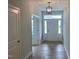 Bright entryway showcasing hardwood floors, recessed lighting, and a view of the front door at 310 N Maple Walk # 236, Garner, NC 27529