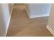 Hallway with wood floors and white trim at 310 N Maple Walk # 236, Garner, NC 27529