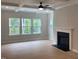 Light filled living room boasts a fireplace, recessed lighting, and lots of natural light at 310 N Maple Walk # 236, Garner, NC 27529