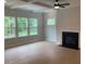 Inviting living room features a fireplace, recessed lighting, and lots of natural light at 310 N Maple Walk # 236, Garner, NC 27529