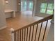 View of the living room and breakfast bar from the staircase landing at 310 N Maple Walk # 236, Garner, NC 27529