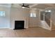 Spacious living room features a fireplace, recessed lighting, hardwood floors and staircase at 310 N Maple Walk # 236, Garner, NC 27529