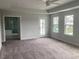 Generously sized main bedroom with lots of natural light and access to en-suite bathroom at 310 N Maple Walk # 236, Garner, NC 27529