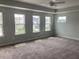 Large main bedroom filled with natural light from several windows at 310 N Maple Walk # 236, Garner, NC 27529