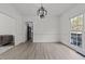 Formal dining room with hardwood floors and large window at 5909 Clarks Fork Dr, Raleigh, NC 27616