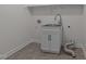 Laundry room with a utility sink and white cabinets at 5909 Clarks Fork Dr, Raleigh, NC 27616