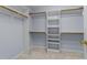 Spacious walk-in closet with shelves and rods at 5909 Clarks Fork Dr, Raleigh, NC 27616