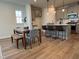 Inviting dining area adjacent to a modern kitchen with a stylish table and comfortable seating at 600 Hillfarm Dr, Wake Forest, NC 27587