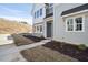 Townhome exterior showcasing gray siding and landscaping at 600 Hillfarm Dr, Wake Forest, NC 27587