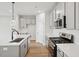 Modern kitchen features gray cabinets, an island, and stainless steel appliances at 600 Hillfarm Dr, Wake Forest, NC 27587