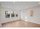 Bright living room with hardwood floors and large windows at 600 Hillfarm Dr, Wake Forest, NC 27587