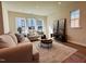 Bright living room with neutral decor, hardwood floors, and large windows for natural light at 600 Hillfarm Dr, Wake Forest, NC 27587