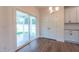 Kitchen dining area with sliding glass doors leading to a screened porch at 6100 Sunset Lake Road Rd, Fuquay Varina, NC 27526