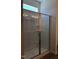 Modern glass shower with a built-in shelf and bright natural lighting at 65 Vili Dr, Broadway, NC 27505