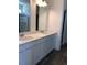 Spacious bathroom vanity with dual sinks, white countertops, and classic cabinetry at 65 Vili Dr, Broadway, NC 27505