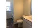 Clean and modern bathroom with white vanity and wood-look vinyl flooring at 65 Vili Dr, Broadway, NC 27505