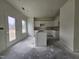 Bright kitchen featuring a large island and white cabinets, ready for appliances at 65 Vili Dr, Broadway, NC 27505