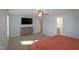 Spacious bedroom with carpet, ceiling fan, and en-suite bathroom at 68 Hampshire Ct, Four Oaks, NC 27524