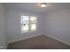 Bright bedroom with carpeted floor and large window at 68 Hampshire Ct, Four Oaks, NC 27524