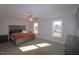 Spacious bedroom with carpeted floor, ceiling fan, and large windows at 68 Hampshire Ct, Four Oaks, NC 27524