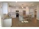 Modern kitchen with island, stainless steel appliances and granite countertops at 68 Hampshire Ct, Four Oaks, NC 27524