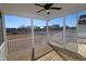 Relaxing screened porch with ceiling fan and wooden deck, offering backyard views at 68 Hampshire Ct, Four Oaks, NC 27524