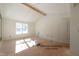 Spacious primary bedroom with vaulted ceiling, door and abundant sunlight at 80 Purslane Dr, Franklinton, NC 27525