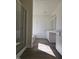 Bright bathroom featuring wood-look floors, white cabinets and marble counters at 87 Vili Dr, Broadway, NC 27505