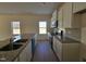 Modern kitchen featuring granite counters, stainless appliances, and ample cabinet space at 87 Vili Dr, Broadway, NC 27505