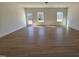 Bright and airy living room with wood flooring and an abundance of natural light from large windows at 87 Vili Dr, Broadway, NC 27505