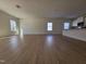 Spacious living room with wood flooring, large windows offering ample natural light at 87 Vili Dr, Broadway, NC 27505