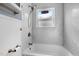 Updated bathroom with subway tile, shower, and bathtub at 909 E F St, Butner, NC 27509