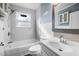 Clean bathroom with white subway tile and updated fixtures at 909 E F St, Butner, NC 27509