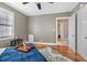 Spacious bedroom with hardwood floors and access to bath at 909 E F St, Butner, NC 27509