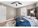 Bedroom with ceiling fan and ample space at 909 E F St, Butner, NC 27509